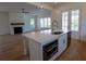Kitchen featuring a large center island, stainless steel appliances and an open concept to the living area at 1432 Fairmont Ave, Atlanta, GA 30318
