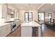 Open kitchen with a large island, stainless steel appliances, and modern finishes at 1432 Fairmont Ave, Atlanta, GA 30318