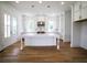 Bright eat-in kitchen featuring a large center island, modern cabinetry, and hardwood floors at 1432 Fairmont Ave, Atlanta, GA 30318