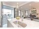 Open kitchen and living room area features a large island with sink and hardwood flooring throughout at 1432 Fairmont Ave, Atlanta, GA 30318