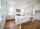Bright eat-in kitchen featuring a large center island, modern cabinetry, and hardwood floors at 1432 Fairmont Ave, Atlanta, GA 30318