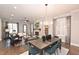 Open concept dining and living room space featuring hardwood floors, a fireplace, and lots of natural light at 1432 Fairmont Ave, Atlanta, GA 30318