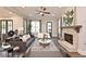 Open concept living room with fireplace, hardwood floors and contemporary furniture at 1432 Fairmont Ave, Atlanta, GA 30318