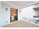 A beautiful covered porch with a view into the kitchen area of the home at 1432 Fairmont Ave, Atlanta, GA 30318