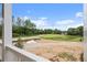 View of construction site and trees from porch at 1432 Fairmont Ave, Atlanta, GA 30318