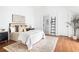 Cozy bedroom featuring stylish furniture, hardwood floors, and neutral decor at 1585 S Ponce De Leon Ne Ave # 19, Atlanta, GA 30307