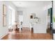 Elegant dining area adjacent to the kitchen, featuring hardwood floors, a round table, and stylish seating for Gathering meals at 1585 S Ponce De Leon Ne Ave # 19, Atlanta, GA 30307
