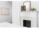 Close-up of a decorative fireplace with white mantle and black tiled hearth, adding a touch of elegance to the space at 1585 S Ponce De Leon Ne Ave # 19, Atlanta, GA 30307