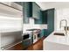 Modern kitchen features stainless steel appliances, custom cabinets and a quartz countertop at 1585 S Ponce De Leon Ne Ave # 19, Atlanta, GA 30307