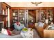 Spacious living room with wood bookcases, leather couch, decorative pillows, and a marble coffee table at 1585 S Ponce De Leon Ne Ave # 19, Atlanta, GA 30307