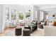 Bright and airy living room with large bay windows and neutral-toned furniture creating a cozy and inviting space at 1585 S Ponce De Leon Ne Ave # 19, Atlanta, GA 30307