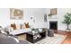 Well-lit living room featuring a decorative fireplace, hardwood floors, and comfortable seating arrangement perfect for relaxation at 1585 S Ponce De Leon Ne Ave # 19, Atlanta, GA 30307