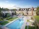 Aerial view of resort-style pool and surrounding property with green spaces and lounge chairs at 1585 S Ponce De Leon Ne Ave # 19, Atlanta, GA 30307