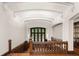 Staircase landing features a stained-glass window, wood railing, and paneled wall at 1585 S Ponce De Leon Ne Ave # 19, Atlanta, GA 30307