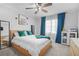 Bright bedroom with soft carpet, natural lighting, ceiling fan, and tasteful decor at 200 Harvell Dr, Bowdon, GA 30108