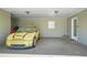 View of the large carport with a yellow car and an additional storage area at 200 Harvell Dr, Bowdon, GA 30108