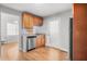 A kitchen featuring wooden cabinets, stainless steel appliances, and light countertops and flooring at 200 Harvell Dr, Bowdon, GA 30108