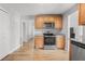 A kitchen featuring wooden cabinets, stainless steel appliances, light countertops, and light flooring at 200 Harvell Dr, Bowdon, GA 30108