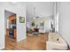 Open concept living room with wood floors, neutral walls and kitchen access at 200 Harvell Dr, Bowdon, GA 30108