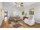 Inviting living room with comfortable seating, wood floors, and bright decor at 200 Harvell Dr, Bowdon, GA 30108