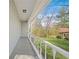Covered porch with white railing and views of the green lawn and surrounding trees at 200 Harvell Dr, Bowdon, GA 30108