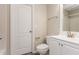 Bright bathroom featuring a white vanity, toilet, and walk-in shower at 407 Red Coat Ln, Woodstock, GA 30188