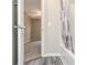 View of a bathroom and carpeted bedroom area from a hallway door at 407 Red Coat Ln, Woodstock, GA 30188