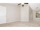 A simple bedroom with a ceiling fan, natural light and neutral walls at 407 Red Coat Ln, Woodstock, GA 30188