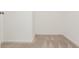 Bedroom with neutral carpet, white walls, and an empty closet space at 407 Red Coat Ln, Woodstock, GA 30188