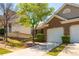 Attractive brick home with a well-manicured lawn and attached one car garage at 407 Red Coat Ln, Woodstock, GA 30188