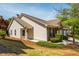 Attractive home with a combination of siding and brick, plus manicured landscaping at 407 Red Coat Ln, Woodstock, GA 30188