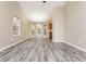 Bright living area with modern floors and large windows at 407 Red Coat Ln, Woodstock, GA 30188