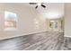 Bright, open living room with vaulted ceilings and hardwood style floors at 407 Red Coat Ln, Woodstock, GA 30188