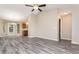 Open-concept living area with modern flooring leading to the kitchen at 407 Red Coat Ln, Woodstock, GA 30188