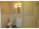 Bathroom featuring a toilet, sink, mirror and standing shower with updated fixtures at 490 Culberson Sw St, Atlanta, GA 30310