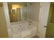 Bathroom featuring a tiled shower and large tub, providing a relaxing space at 490 Culberson Sw St, Atlanta, GA 30310