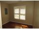 Bedroom features hardwood floors, neutral walls, and a window providing ample natural light at 490 Culberson Sw St, Atlanta, GA 30310