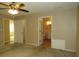 Bedroom with view to hallway, closet and bathroom; neutral walls and a ceiling fan at 490 Culberson Sw St, Atlanta, GA 30310