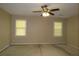 Bedroom features neutral walls, ceiling fan, and two windows providing ample natural light at 490 Culberson Sw St, Atlanta, GA 30310