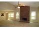 Inviting living room with high ceilings, brick fireplace and windows for natural light at 490 Culberson Sw St, Atlanta, GA 30310