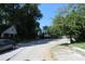 View of a quiet, tree-lined street with a partial view of a neighboring house at 490 Culberson Sw St, Atlanta, GA 30310