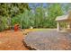 Sprawling backyard features mature trees, swing set, and ample space for recreation at 11540 Northgate Way, Roswell, GA 30075