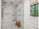 Elegant shower room featuring marble tile and a frameless glass shower with dual shower heads at 11540 Northgate Way, Roswell, GA 30075