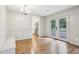Bright dining room featuring hardwood floors, modern lighting, built-in seating and french doors to the backyard at 11540 Northgate Way, Roswell, GA 30075