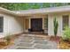 Welcoming front entrance with double doors, stone pathway, and lush landscaping at 11540 Northgate Way, Roswell, GA 30075