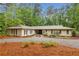 Charming ranch-style home with well-manicured landscaping and a circular driveway at 11540 Northgate Way, Roswell, GA 30075