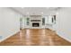 Bright living room featuring hardwood floors, a fireplace, and plenty of natural light at 11540 Northgate Way, Roswell, GA 30075