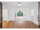 Bright and airy living room with hardwood floors and large windows overlooking the backyard at 11540 Northgate Way, Roswell, GA 30075
