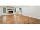 Spacious living room featuring a cozy fireplace, and hardwood floors at 11540 Northgate Way, Roswell, GA 30075