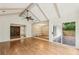 Open-concept living area with hardwood floors, vaulted ceilings, and ample natural light at 11540 Northgate Way, Roswell, GA 30075
